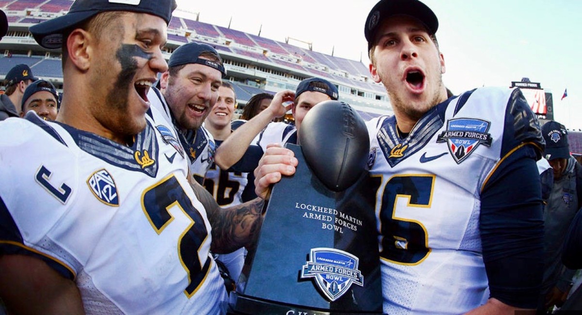 Jared Goff, right, and teammates celebrate the Armed Force Bowl victory.