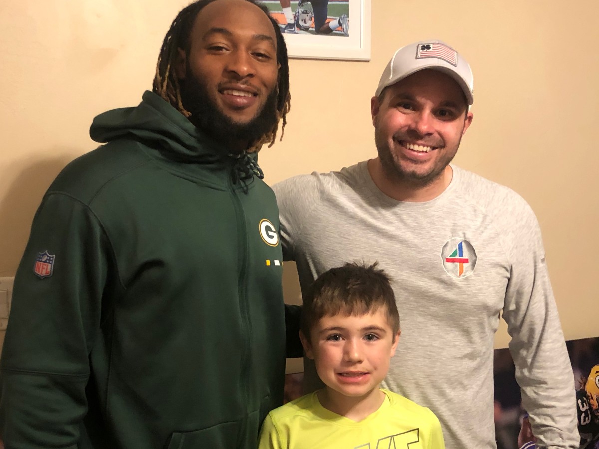 Aaron Jones, Joe Tofferi and Tofferi's son, Remi.