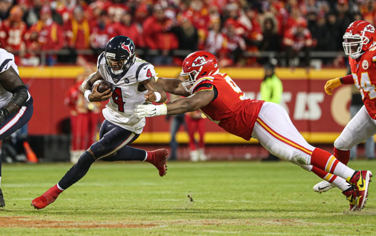 Houston Texans quarterback Deshaun Watson (4) runs against Kansas City Chiefs nose tackle Derrick Nnadi (91) during the second half in a AFC Divisional Round playoff football game at Arrowhead Stadium. (Jay Biggerstaff-USA TODAY Sports)