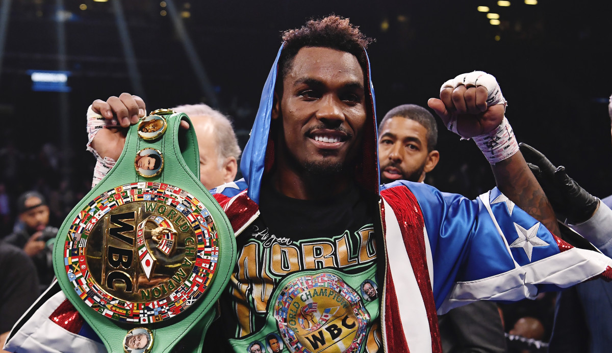 Jermall Charlo (blue and red trunks) reacts after knocking out Dennis Hogan of Ireland (white trunk) in the seventh round during a middleweight world championship fight at Barclays Center.