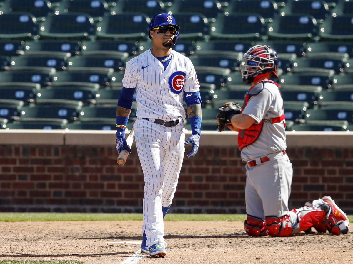 Aug 19, 2020; Chicago, Illinois, USA; Chicago Cubs shortstop Javier Baez (9) reacts after striking out against the St. Louis Cardinals during the fifth inning at Wrigley Field.