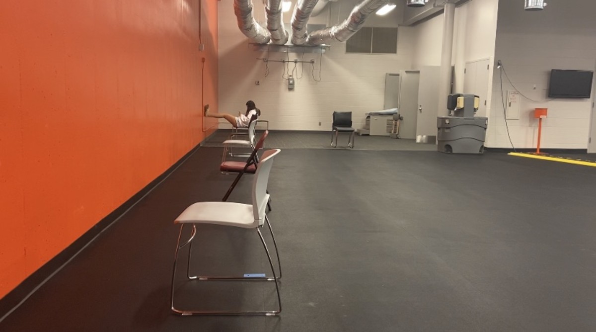 Waiting area for test results. Chairs are spaced 6 feet apart, facing the wall. 