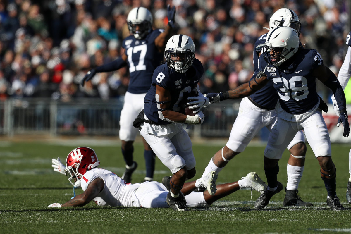Penn State Nittany Lions cornerback Marquis Wilson (8) runs with the ball after a fumble recovery while Indiana Hoosiers wide receiver Whop Philyor (1) reacts during the second quarter at Beaver Stadium.