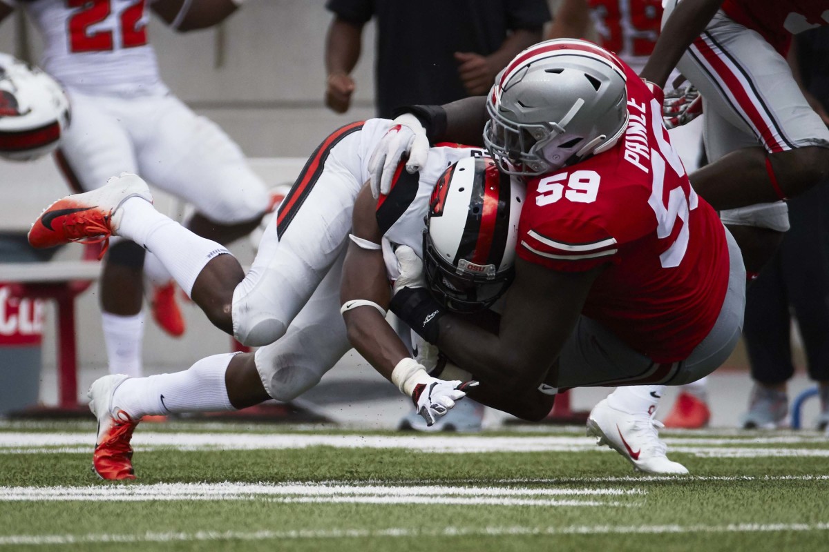 Isaiah Prince tackles an Oregon State player during the 2018 opener.