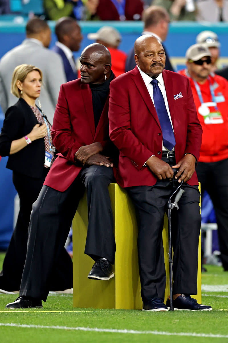 NFL 100 All-Time Team members Lawrence Taylor (left) and Jim Brown before Super Bowl LIV between the 49ers and the Chiefs at Hard Rock Stadium, Feb. 2, 2020