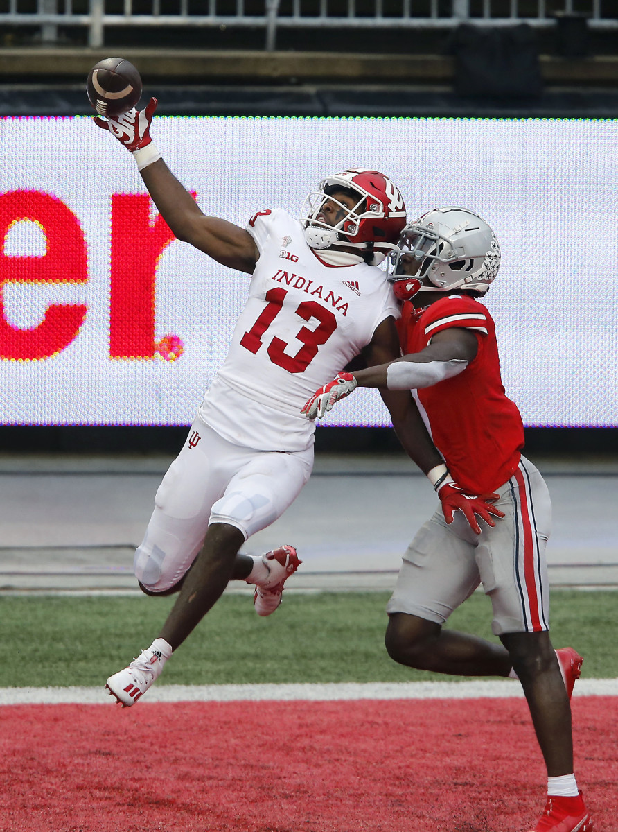Indiana Hoosiers wide receiver Miles Marshall (13) goes up for the pass while defended by Ohio State Buckeyes cornerback Sevyn Banks (7)during the first quarter at Ohio Stadium.