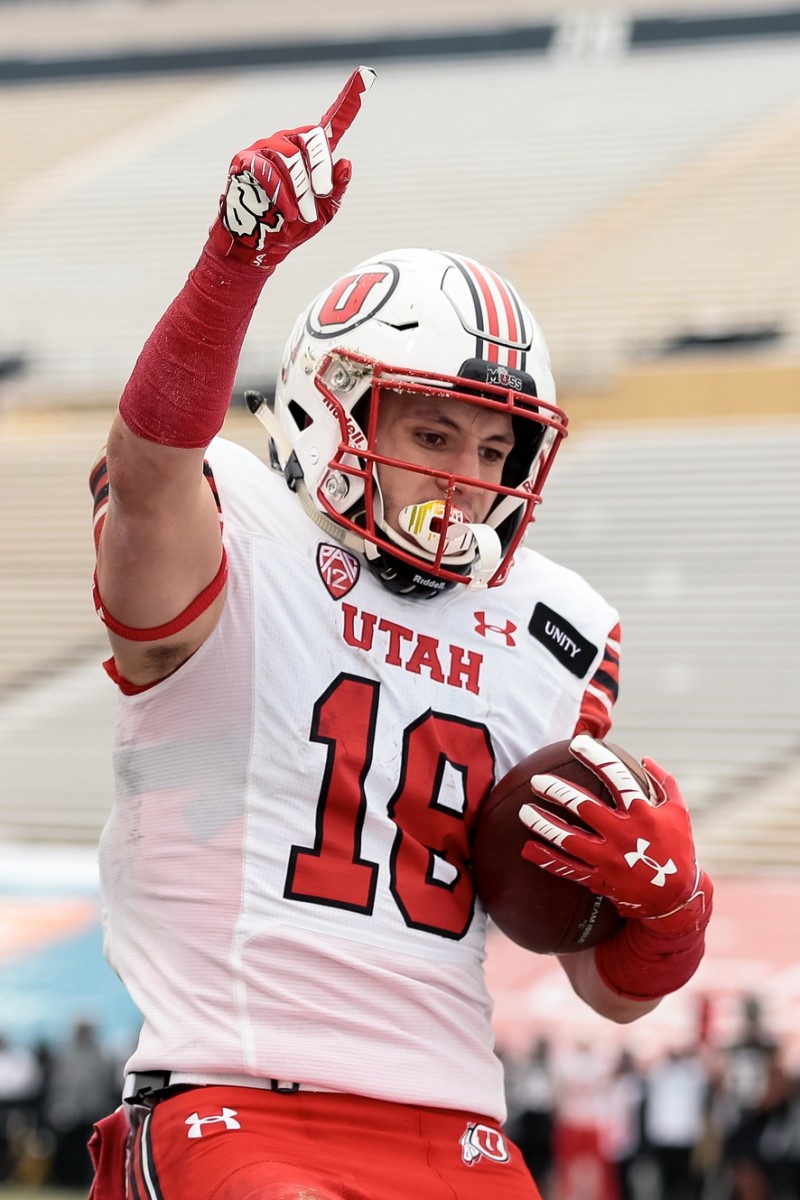 Dec 12, 2020; Boulder, Colorado, USA; Utah Utes wide receiver Britain Covey (18) celebrates after scoring a touchdown against the Colorado Buffaloes in the third quarter at Folsom Field.