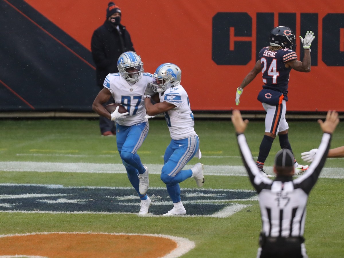 Cephus is congratulated for scoring a touchdown against the Chicago Bears. 