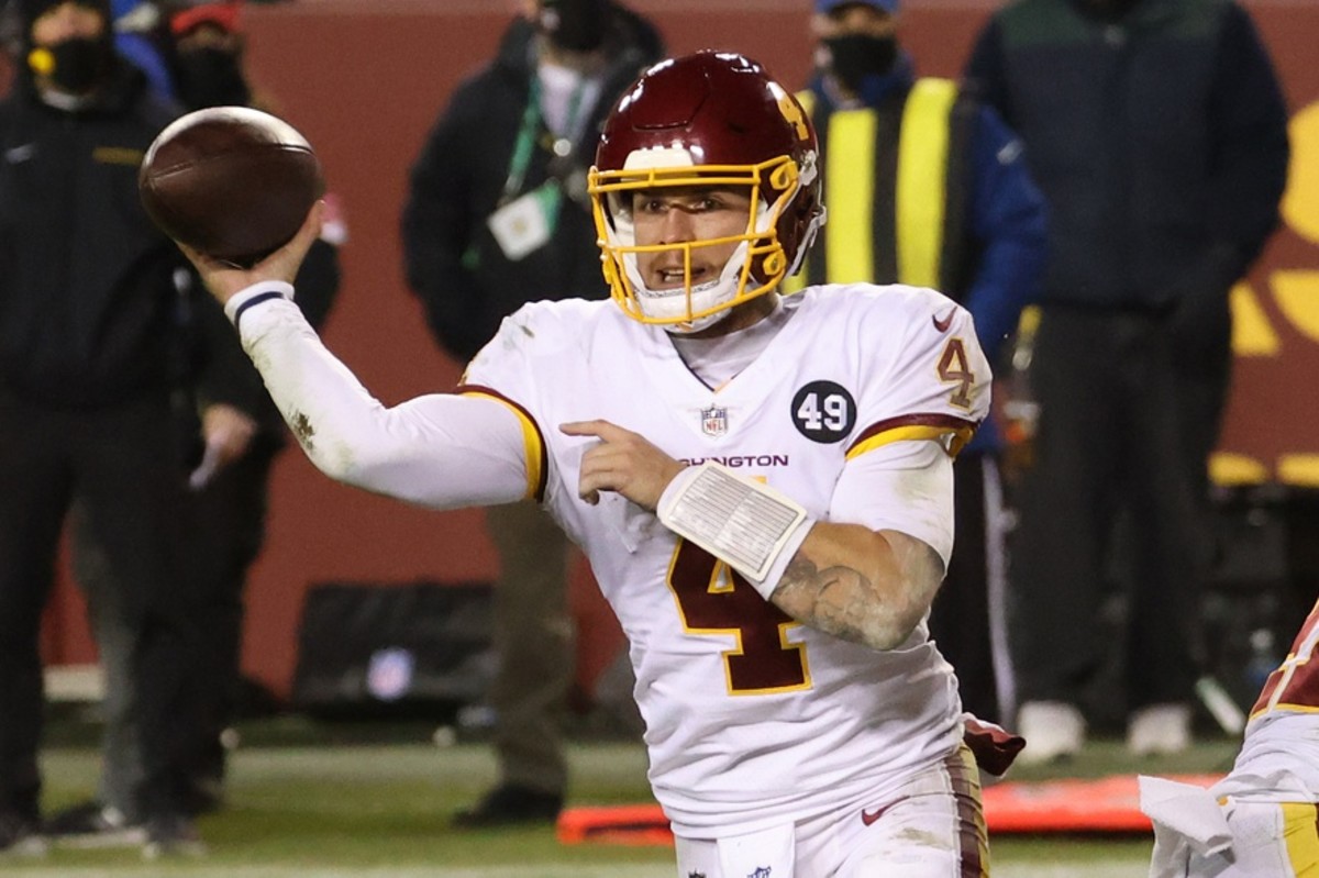 Jan 9, 2021; Landover, Maryland, USA; Washington Football Team quarterback Taylor Heinicke (4) passes the ball against the Tampa Bay Buccaneers at FedExField.