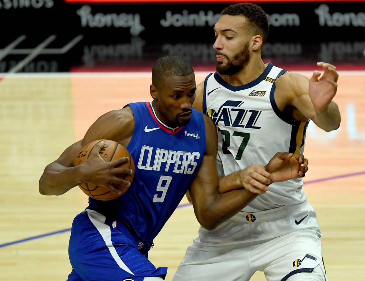 Rudy Gobert (27) guards Serge Ibaka (9) as Ibaka drives into the paint
