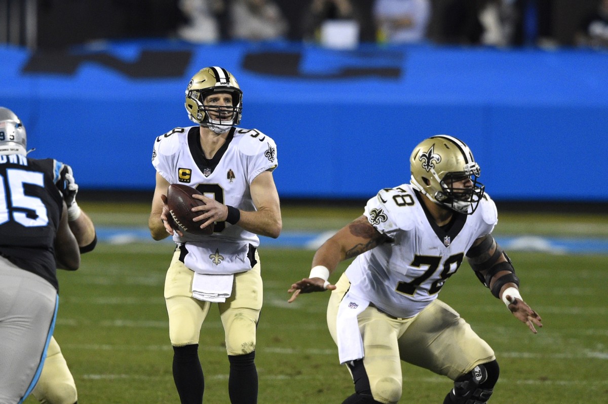 Jan 3, 2021; Charlotte, North Carolina, USA; Saints quarterback Drew Brees (9) looks to pass as center Erik McCoy (78) blocks at Bank of America Stadium. Mandatory Credit: Bob Donnan-USA TODAY Sports