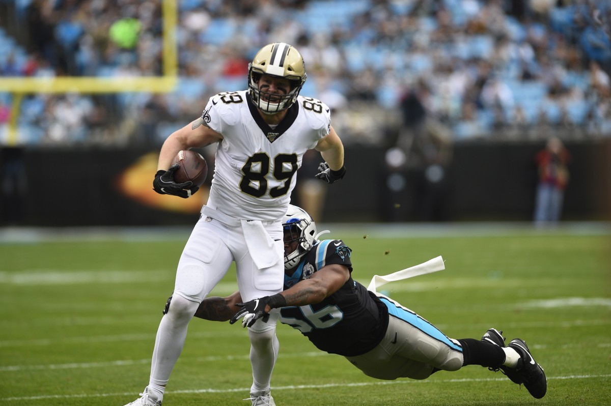 Dec 29, 2019; Charlotte, North Carolina, USA; Saints tight end Josh Hill (89) with the ball as Panthers linebacker Jermaine Carter (56). Mandatory Credit: Bob Donnan-USA TODAY 
