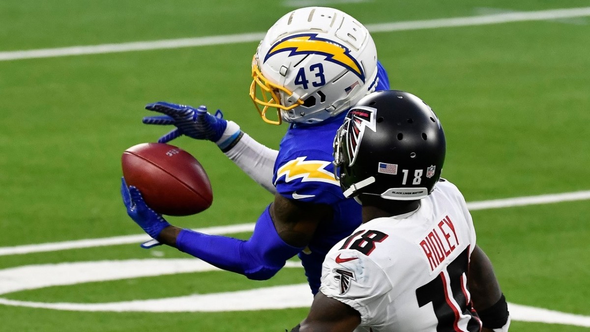 Davis intercepts a pass in front of Atlanta Falcons wide receiver Calvin Ridley. 