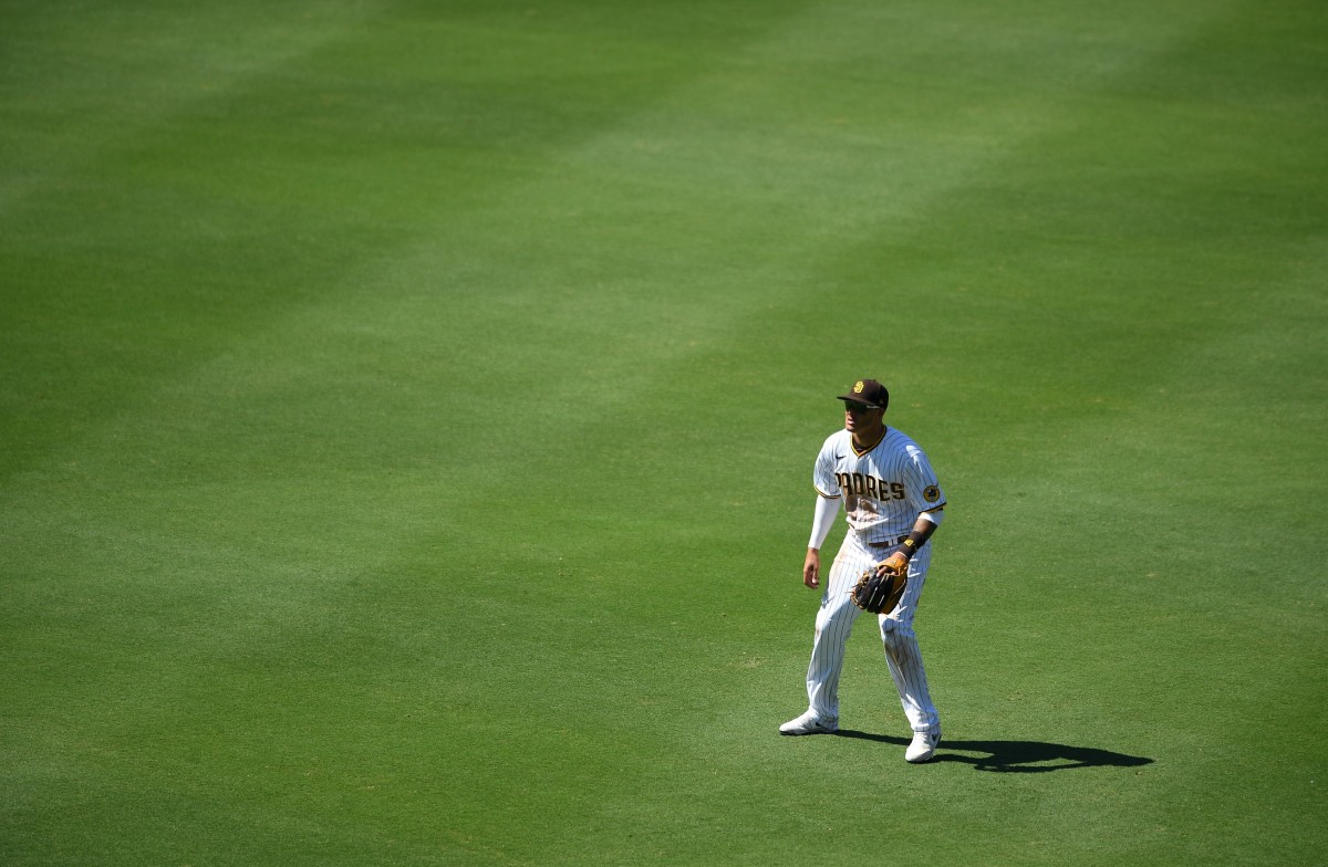 Jul 27, 2020; San Diego, California, USA; San Diego Padres third baseman Manny Machado (13) plays in shallow right field on a defensive shift on Arizona Diamondbacks left fielder David Peralta (not pictured) during the sixth inning at Petco Park. Credit: Orlando Ramirez-USA TODAY Sports
