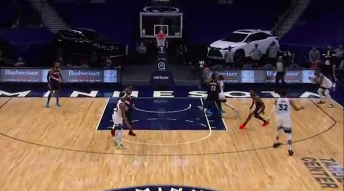 Damian Lillard is behind Robert Covington and Ricky Rubio. He's moving, but he's not all that close to the restricted area.