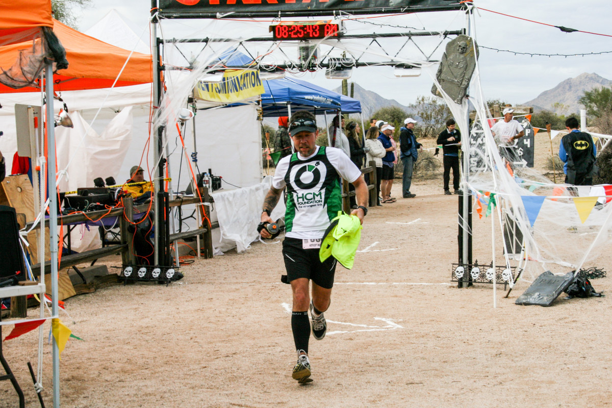 HCM, a jersey-sponsor nonprofit for which Agnew (at the start-finish line of the Javelina 100) raised money, parted ways with the runner in 2012, around the time he moved to Utah.