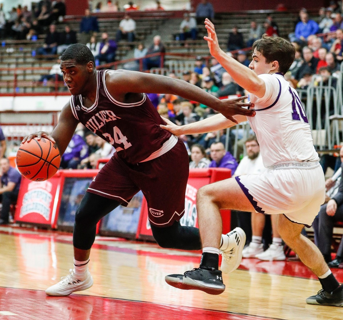 Deontae Craig (24) drives for a layup against Bloomington South's Connor Hickman (10) in a game last December. (Grace Hollars/Indianapolis Star for USA Today Sports)
