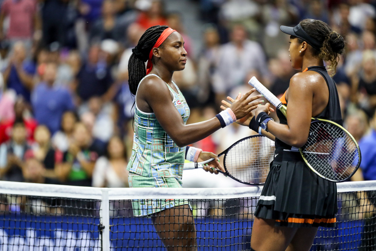Naomi Osaka (right) and an end-of-her run Coco Gauff head in for a shake and a hug following a fourth-round U.S. Open match last August.