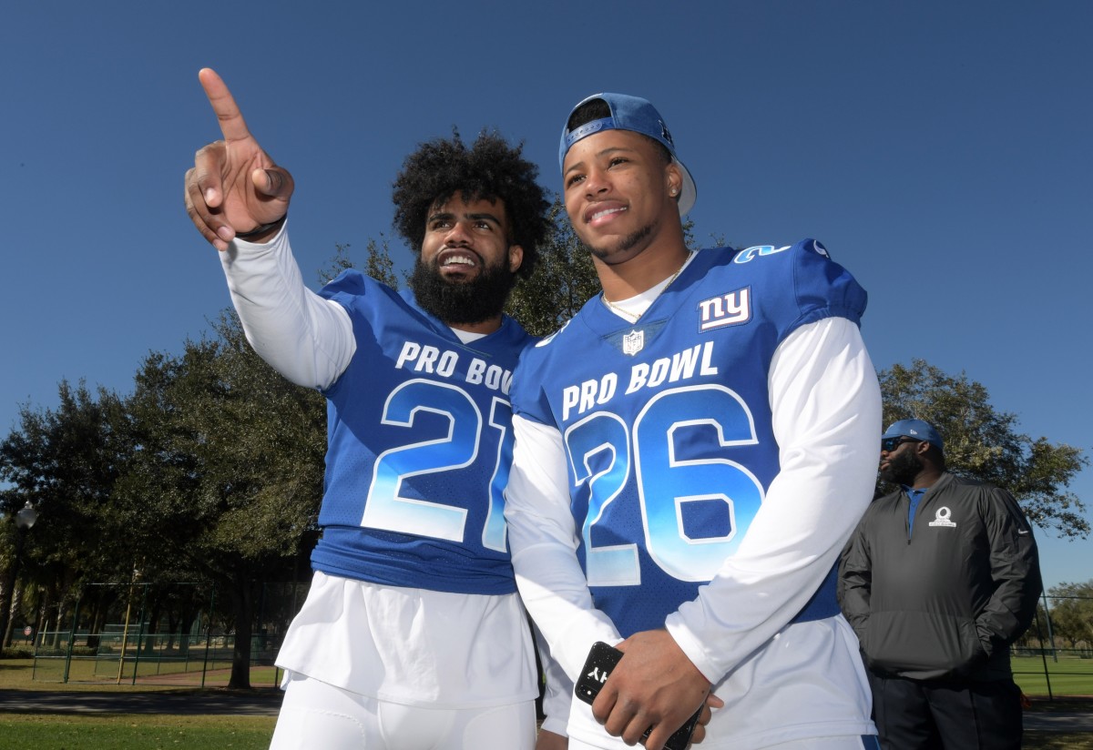 Jan 25, 2019; Kissimmee, FL, USA; Dallas Cowboys running back Ezekiel Elliott (26) and New York Giants running back Saquon Barkley (26) pose during NFC practice at ESPN Wide World of Sports Complex.