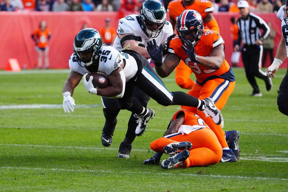 Boston Scott dives for yards in first quarter vs. Broncos in Week 10