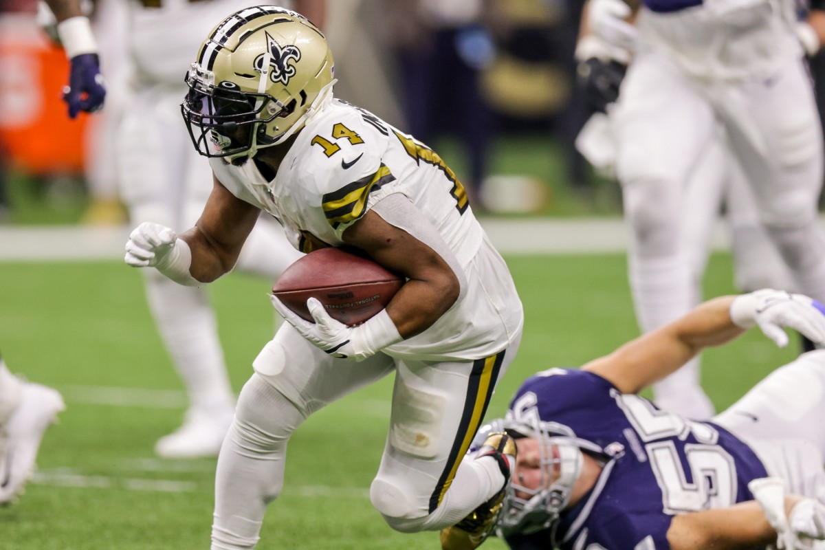 New Orleans Saints running back Mark Ingram II (14) runs past Dallas linebacker Leighton Vander Esch (55). Mandatory Credit: Stephen Lew-USA TODAY Sports