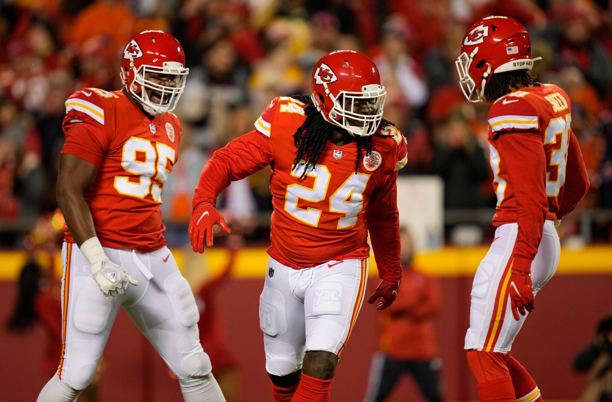 Dec 5, 2021; Kansas City, Missouri, USA; Kansas City Chiefs linebacker Melvin Ingram III (24) celebrates with defensive tackle Chris Jones (95) and cornerback L'Jarius Sneed (38) after a play against the Denver Broncos during the first half at GEHA Field at Arrowhead Stadium. Mandatory Credit: Jay Biggerstaff-USA TODAY Sports
