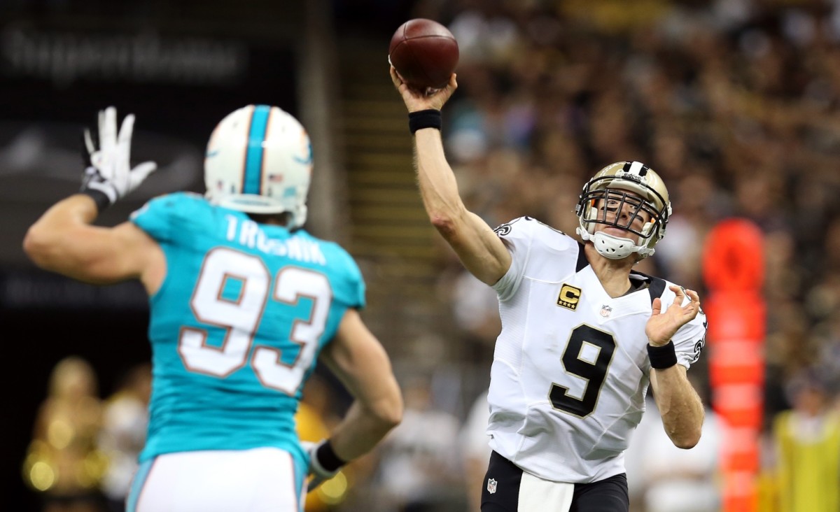 New Orleans Saints quarterback Drew Brees (9) throws over Dolphins linebacker Junior Galette (93). Mandatory Credit: Chuck Cook-USA TODAY 