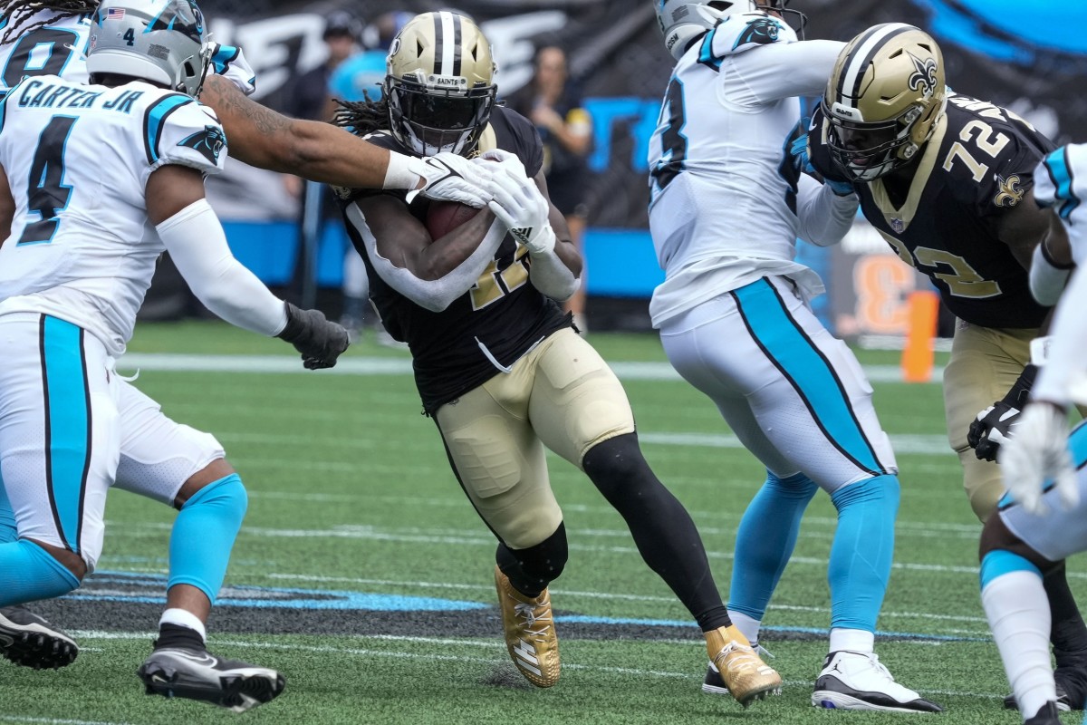 Carolina Panthers defensive tackle Bravvion Roy (93) tackles Saints running back Alvin Kamara (41). Mandatory Credit: Jim Dedmon-USA TODAY