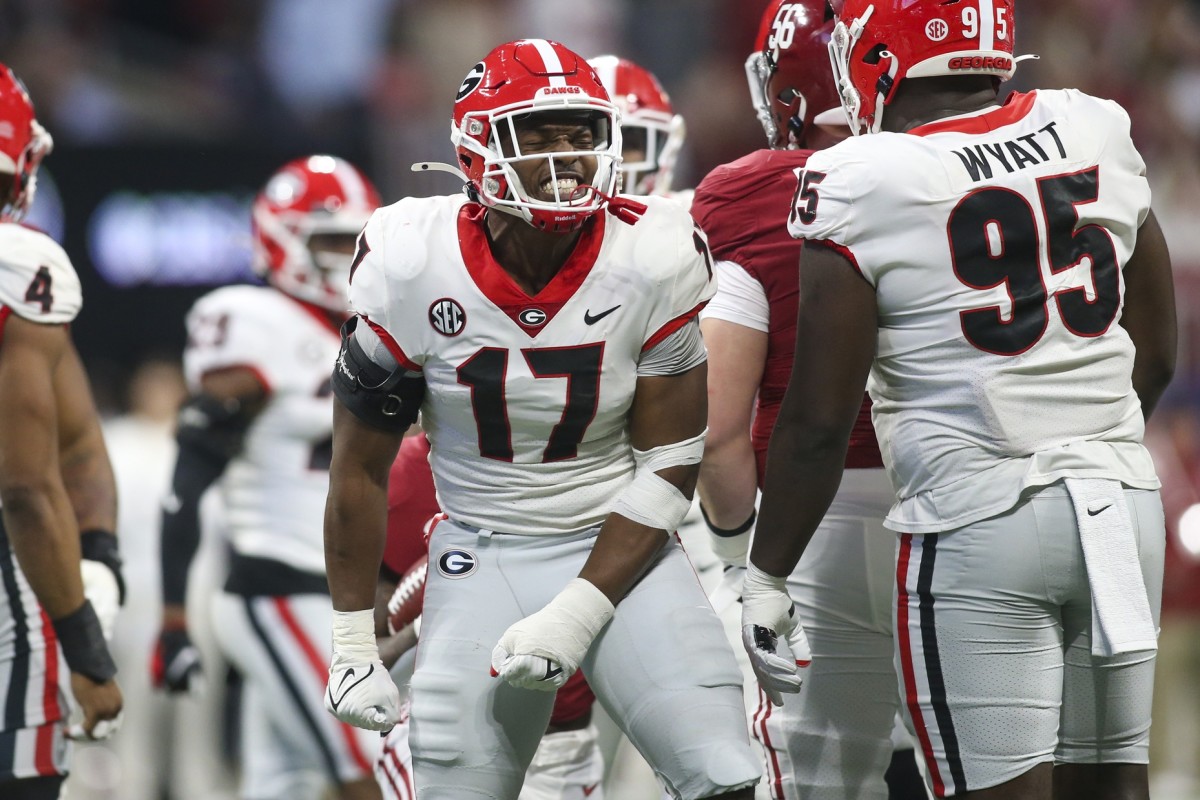 George LB Nakobe Dean celebrates tackle