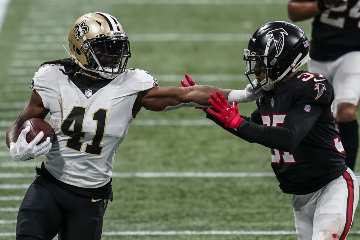New Orleans Saints running back Alvin Kamara (41) fights off Atlanta safety Ricardo Allen (37) for extra yardage. Mandatory Credit: Dale Zanine-USA TODAY Sports