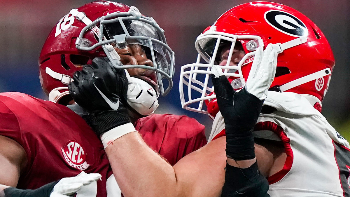 Georgia OL Warren Ericson (50) and Alabama WR Slade Bolden (18) play during the SEC title game.