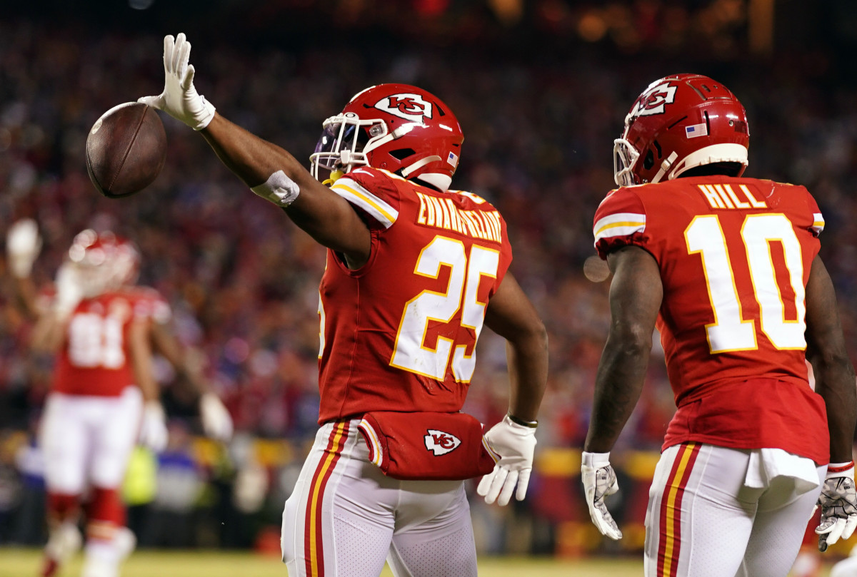 Jan 23, 2022; Kansas City, Missouri, USA; Kansas City Chiefs running back Clyde Edwards-Helaire (25) reacts with the ball against the Buffalo Bills during the first half in the AFC Divisional playoff football game at GEHA Field at Arrowhead Stadium. Mandatory Credit: Jay Biggerstaff-USA TODAY Sports