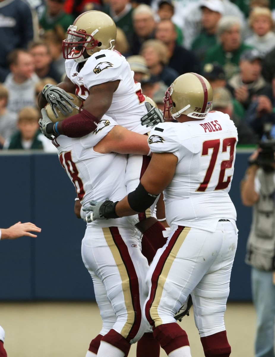 Oct. 13, 2007; South Bend, IN, USA; Boston College Eagles running back Andre Callender (32) celebrates his first quarter touchdown against the Notre Dame Fighting Irish with guard Ty Hall (78) and tackle Ryan Poles (72) in the first quarter at Notre Dame Stadium. Mandatory Credit: Matt Cashore-USA TODAY Sports