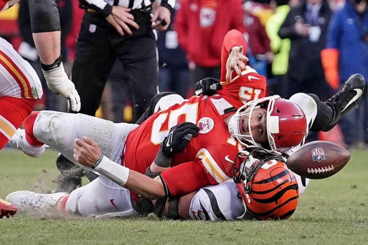 Jan 30, 2022; Kansas City, Missouri, USA; Cincinnati Bengals defensive end Sam Hubbard (94) sacks Kansas City Chiefs quarterback Patrick Mahomes (15) to cause a fumble during the fourth quarter of the AFC Championship Game at GEHA Field at Arrowhead Stadium. Mandatory Credit: Denny Medley-USA TODAY Sports
