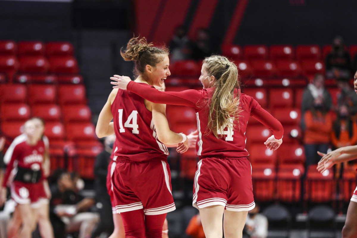 Ali Patberg and Nicole Cardaño-Hillary celebrate after a play.