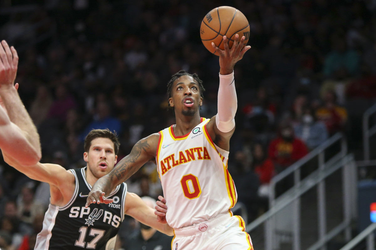 Feb 11, 2022; Atlanta, Georgia, USA; Atlanta Hawks guard Delon Wright (0) shoots against the San Antonio Spurs in the second half at State Farm Arena.
