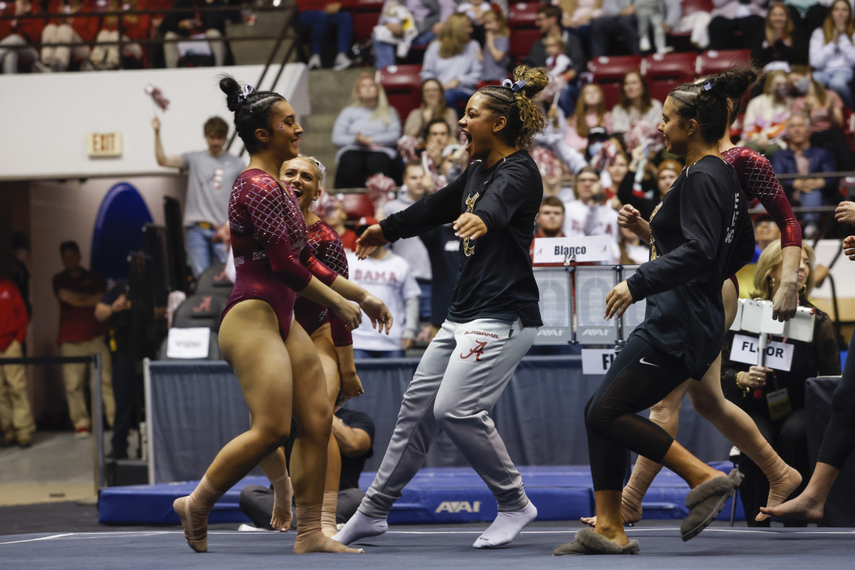 Luisa Blanco celebrates on floor against Missouri