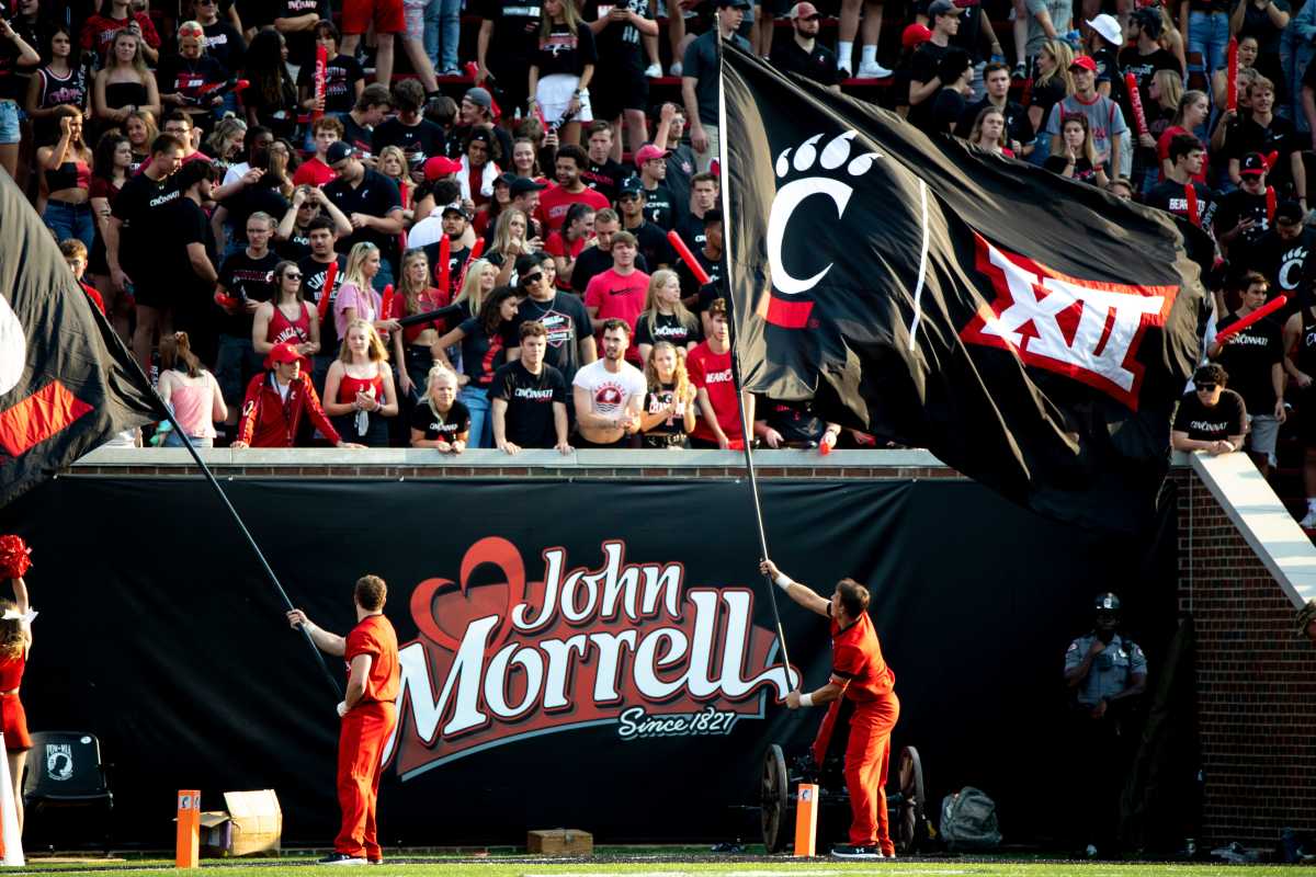 Cincinnati Bearcats Cheerleaders waive flags with the Big 12 logo in the second half of the NCAA football game between Cincinnati Bearcats and Murray State Racers on Saturday, Sept. 11, 2021, at Nippert Stadium in Cincinnati. Murray State Racers At Cincinnati Bearcats