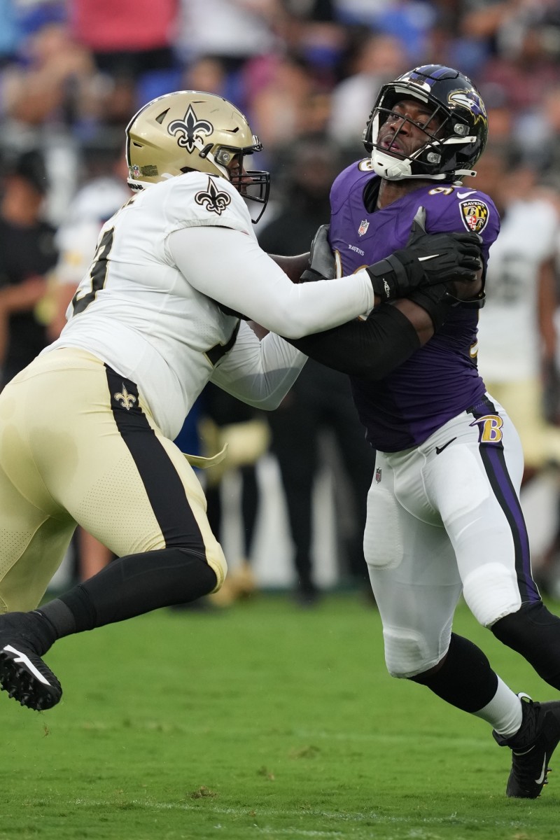 New Orleans Saints tackle Ethan Greenidge (73) blocks Ravens linebacker Odafe Oweh (99). Mandatory Credit: Mitch Stringer-USA TODAY