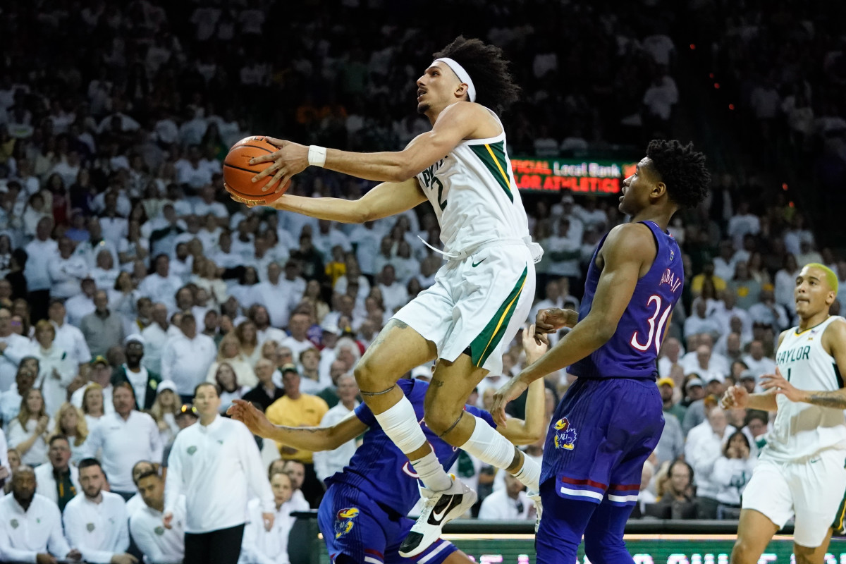 Feb 26, 2022; Waco, Texas, USA; Baylor Bears guard Kendall Brown (2) scores a layup against Kansas Jayhawks guard Ochai Agbaji (30) during the second half at Ferrell Center.