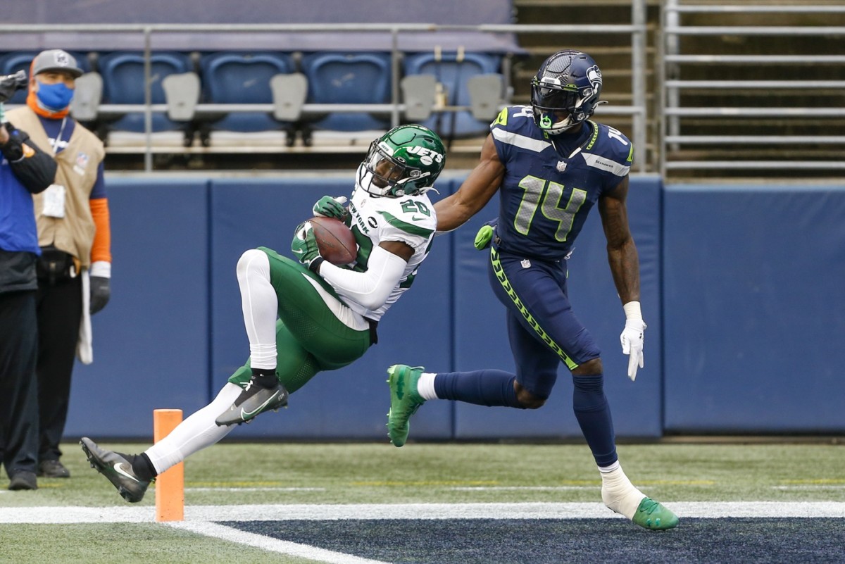 Jets free safety Marcus Maye (20) intercepts a pass intended for Seahawks receiver DK Metcalf (14). Mandatory Credit: Joe Nicholson-USA TODAY Sports