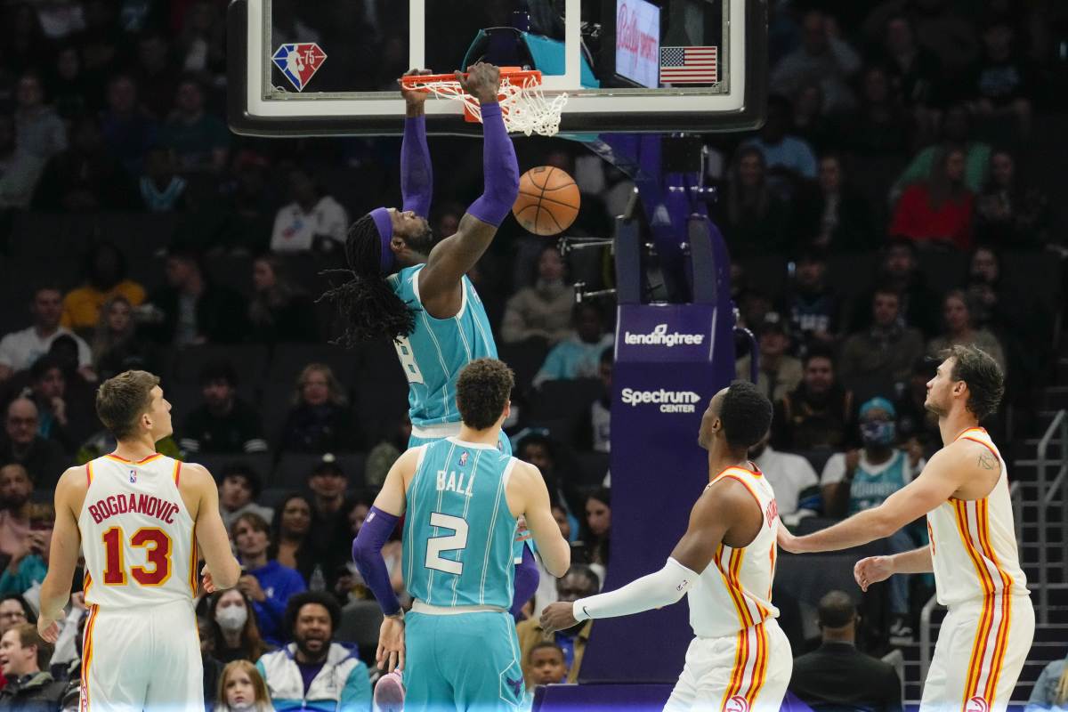 Mar 16, 2022; Charlotte, North Carolina, USA; Charlotte Hornets center Montrezl Harrell (8) dunks against the Atlanta Hawks during the second quarter at the Spectrum Center.