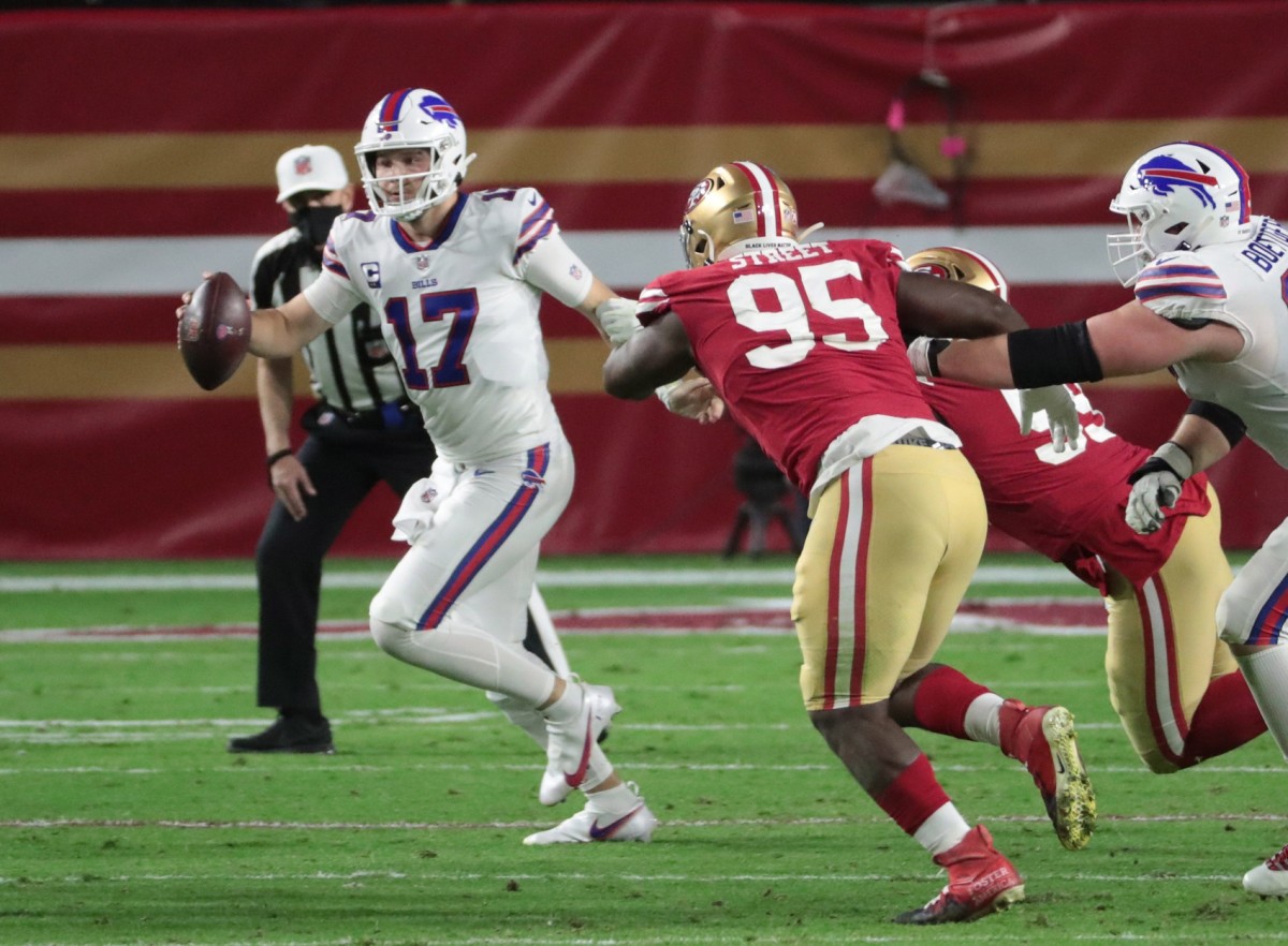Buffalo quarterback Josh Allen (17) scrambles out of the pocket against 49ers defensive end Kentavius Street (95). Mandatory Credit: Michael Chow-Arizona Republic 