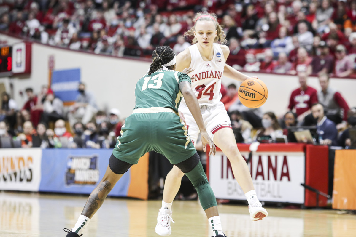 Grace Berger is met by a Charlotte defender.