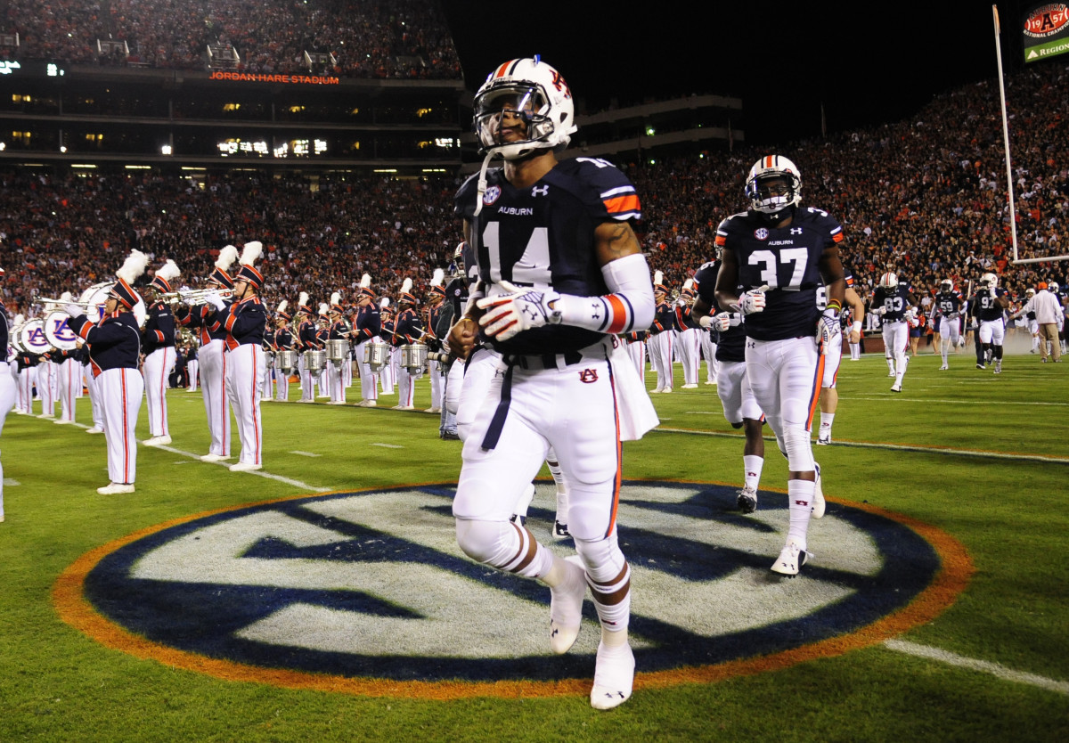 Oct 25, 2014; Auburn, AL, USA; Auburn Tigers quarterback Nick Marshall (14) runs onto the field for the game against the South Carolina Gamecocks at Jordan Hare Stadium. Auburn won 42-35. Mandatory Credit: Shanna Lockwood-USA TODAY Sports
