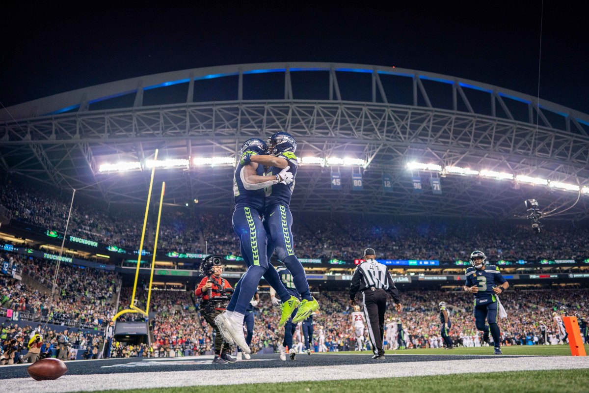 December 29, 2019; Seattle, Washington, USA; Seattle Seahawks wide receiver D.K. Metcalf (14, left) is congratulated by wide receiver Tyler Lockett (16, right) after scoring a touchdown during the fourth quarter against the San Francisco 49ers at CenturyLink Field. Mandatory Credit: Kyle Terada-USA TODAY Sports