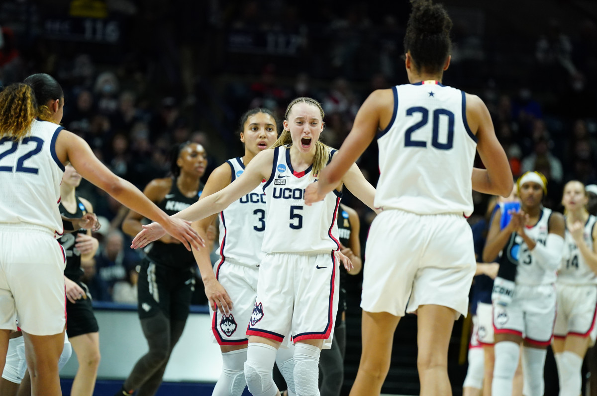 Paige Bueckers celebrates a play with her team.
