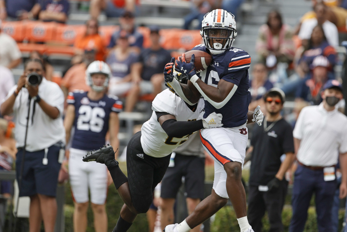 Sep 11, 2021; Auburn, Alabama, USA; Auburn Tigers wide receiver Malcolm Johnson Jr. (16) makes a catch as Alabama State Hornets defensive back Rodney Echols (25) defends during the third quarter at Jordan-Hare Stadium. Mandatory Credit: John Reed-USA TODAY Sports