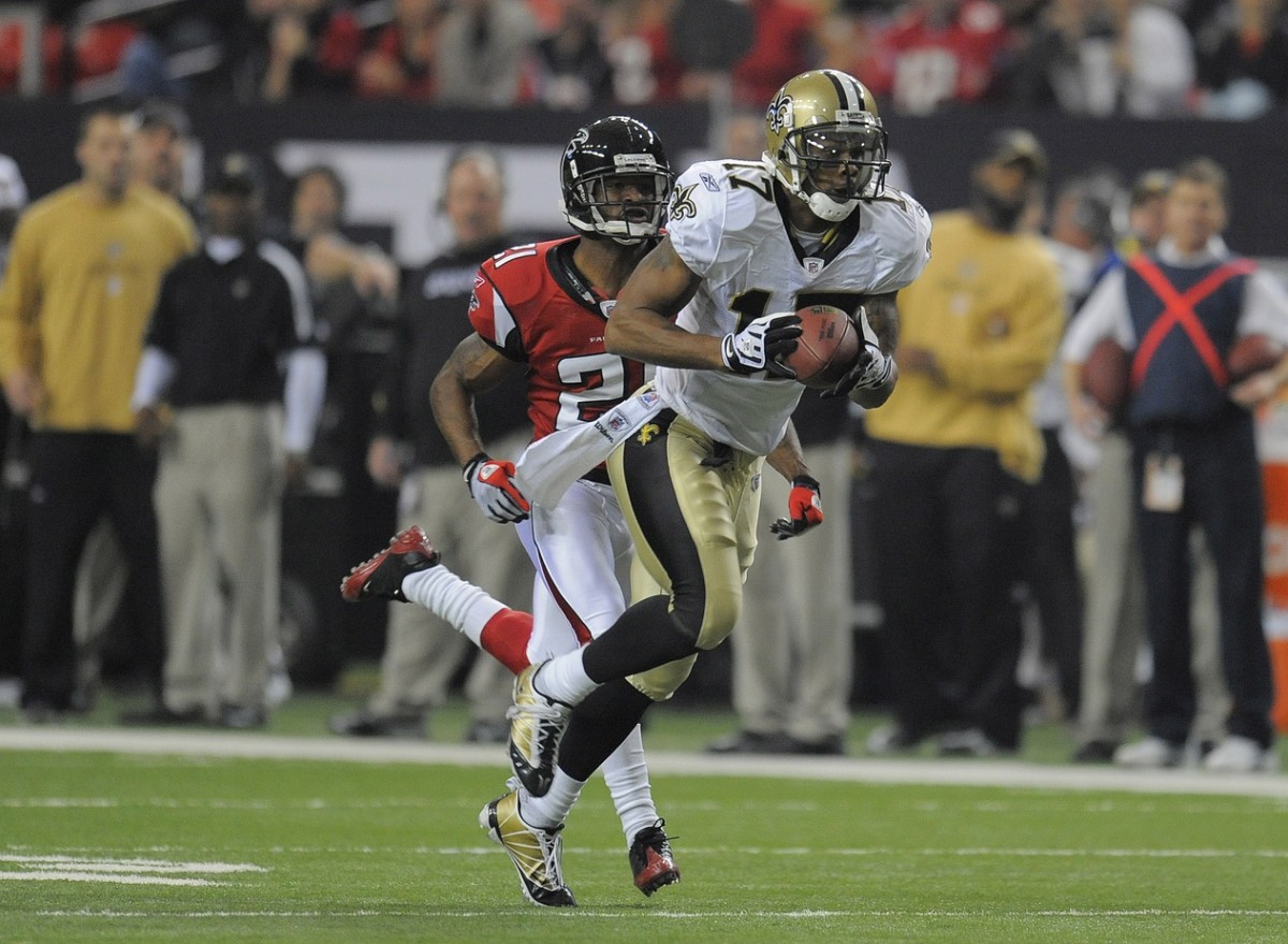 Dec 13, 2009; New Orleans Saints receiver Robert Meachem catches a pass behind Falcons cornerback Chris Owens. Mandatory Credit: Dale Zanine-USA TODAY Sports