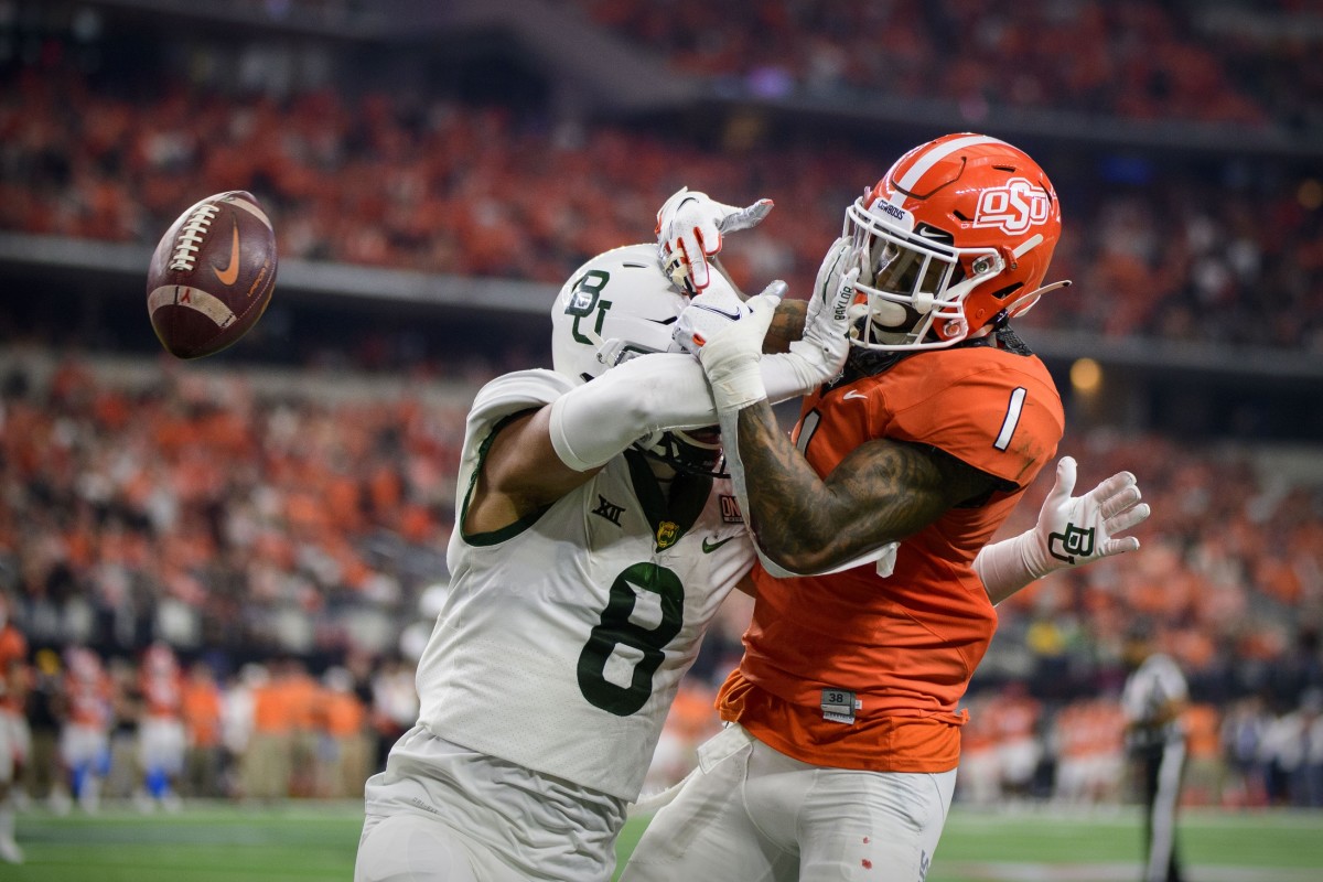 Baylor safety Jalen Pitre (8) breaks up a pass intended for Oklahoma State receiver Tay Martin (1) in the Big 12 Conference championship game. Mandatory Credit: Jerome Miron-USA TODAY